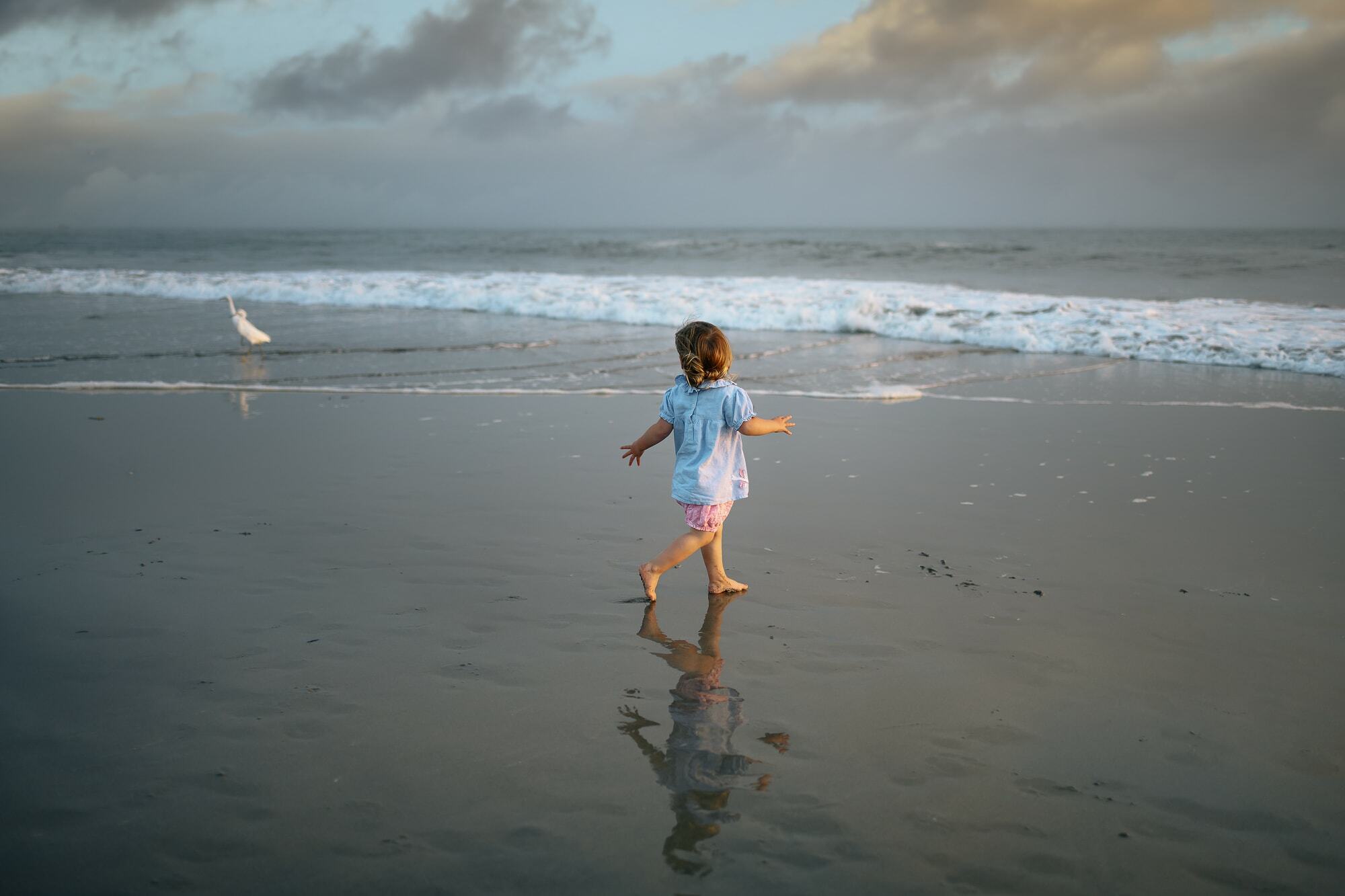 kid playing in the ocean