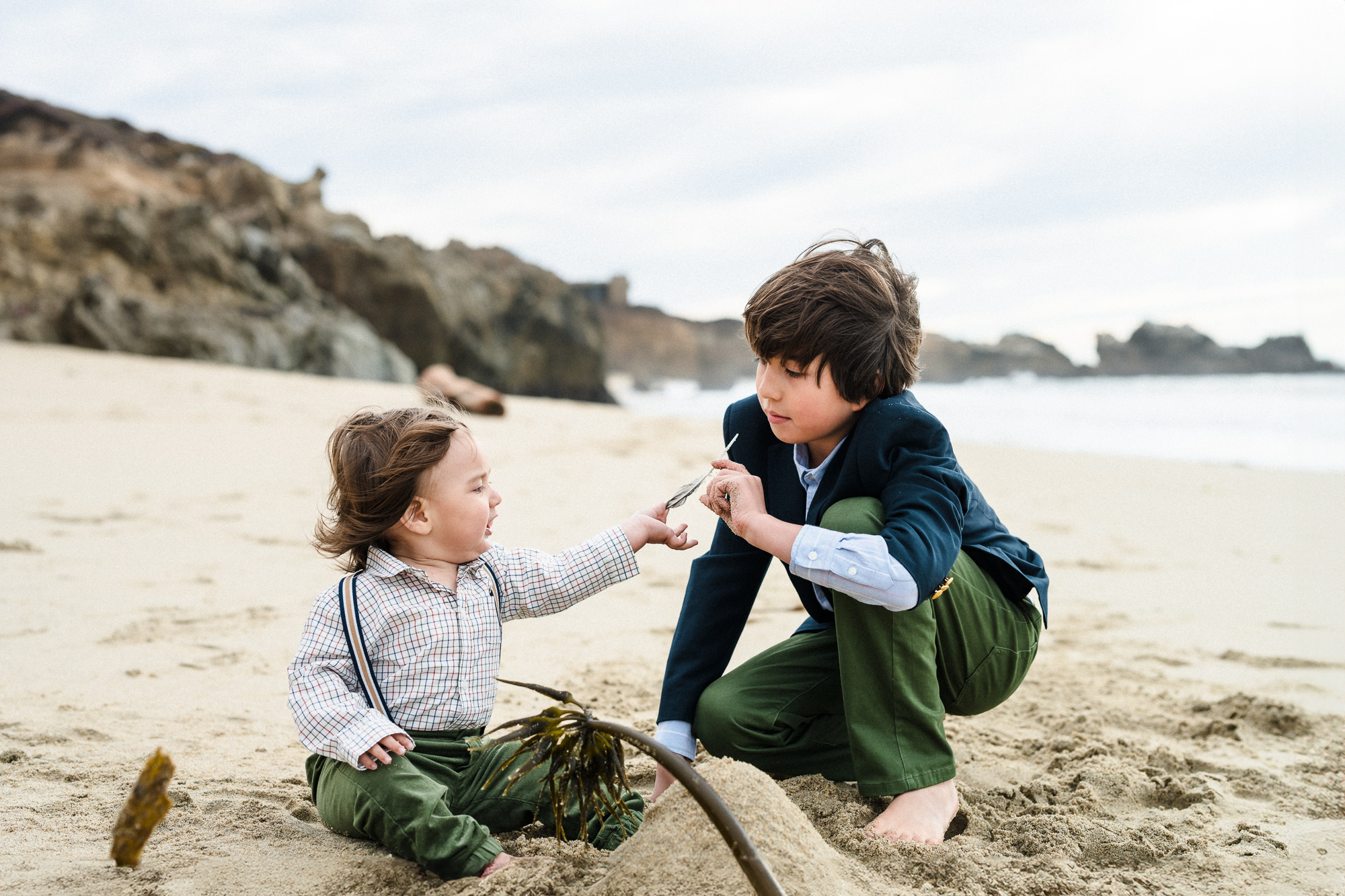 siblings playing on the beach